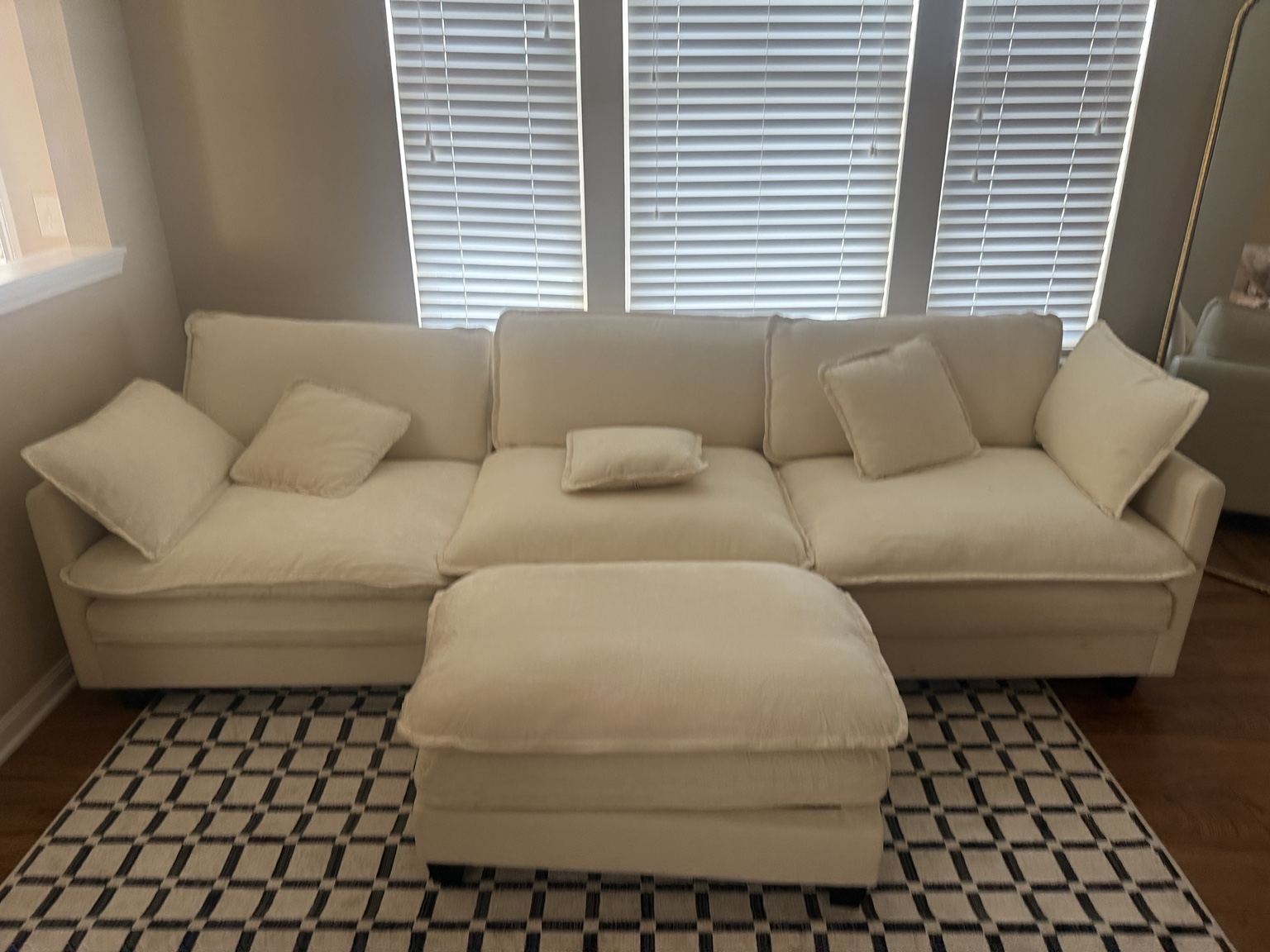 White sectional sofa assembled and arranged