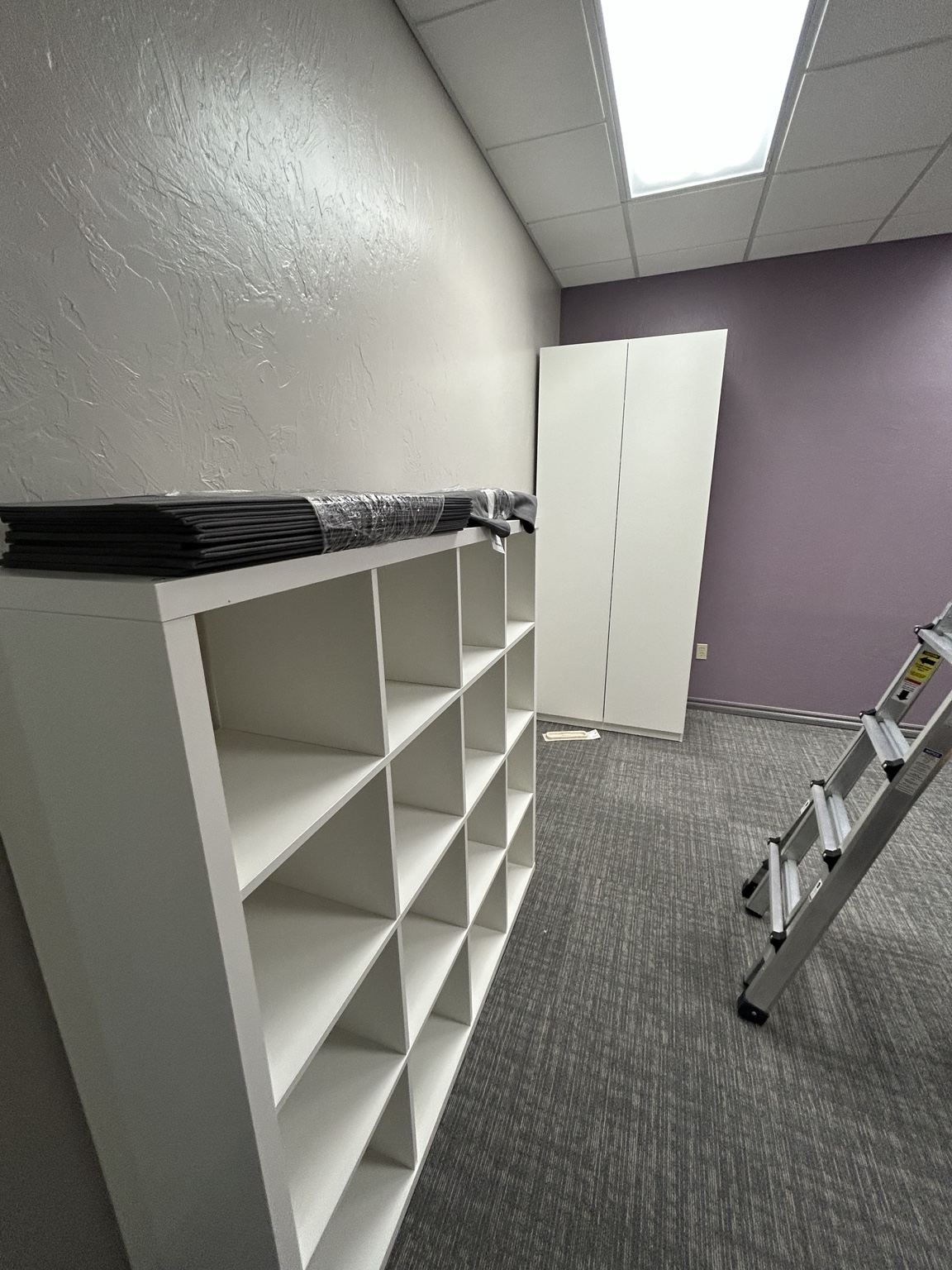 White storage shelving assembled and installed