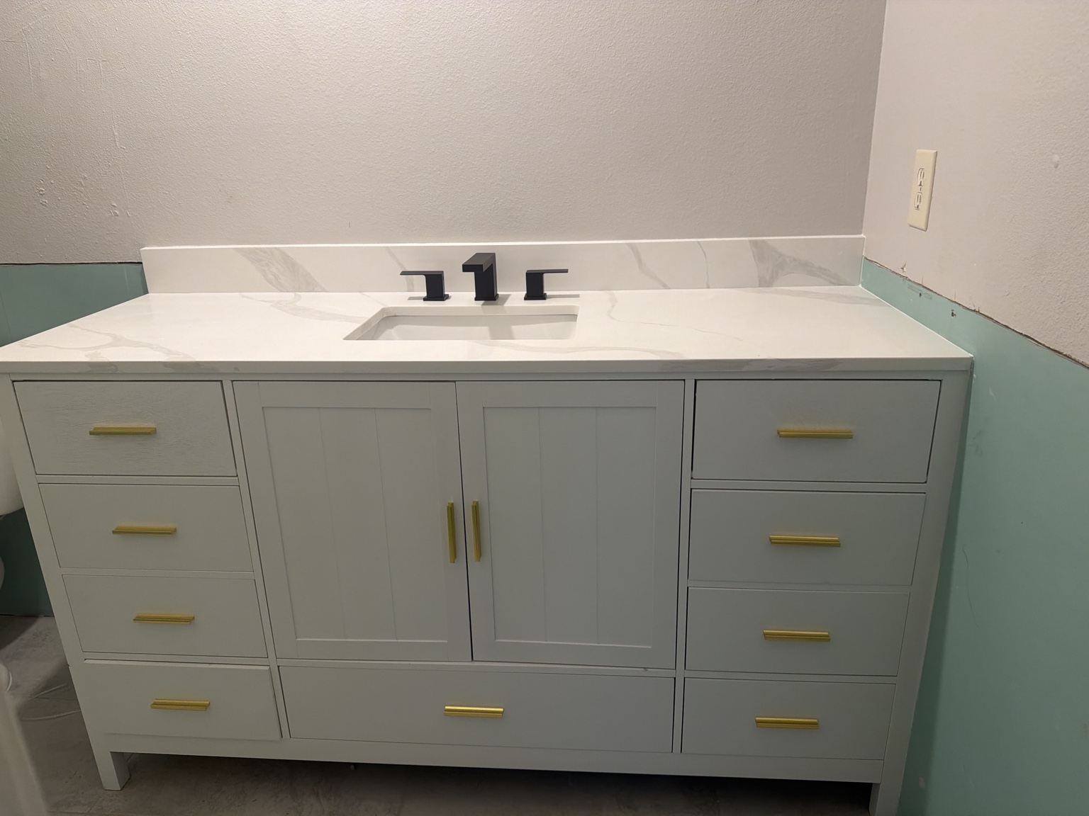 Completed bathroom vanity and sink installation